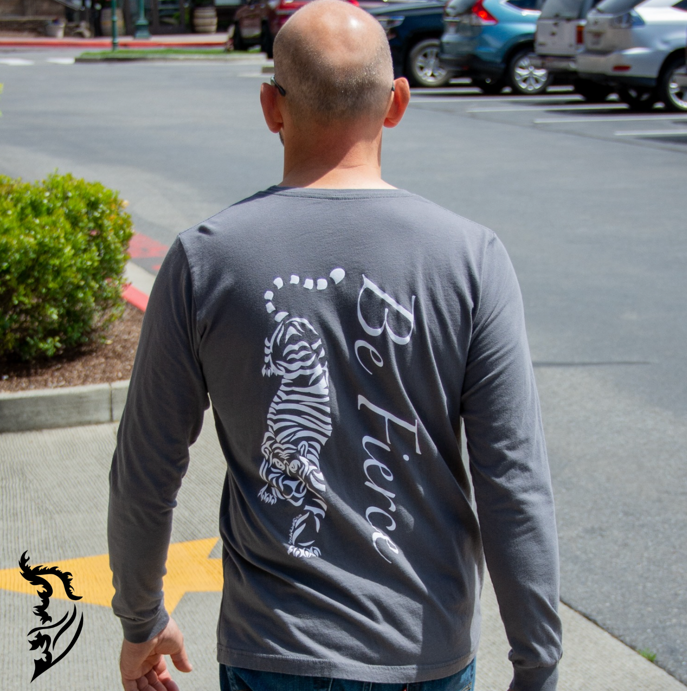 Model wearing a gray long sleeve tee featuring the Be Fierce Tiger design. Back View