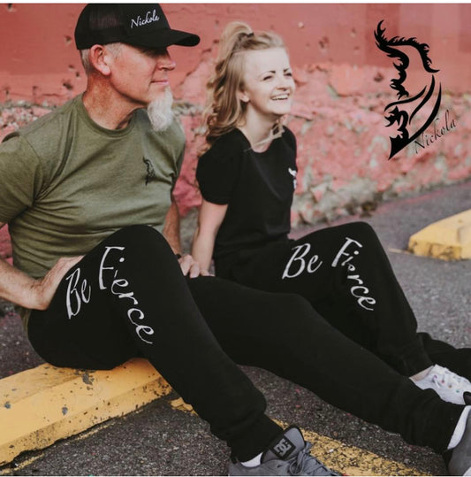 Two models wearing the Be Fierce Joggers with a sleek street-style design, perfect for active wear or casual lounging.
