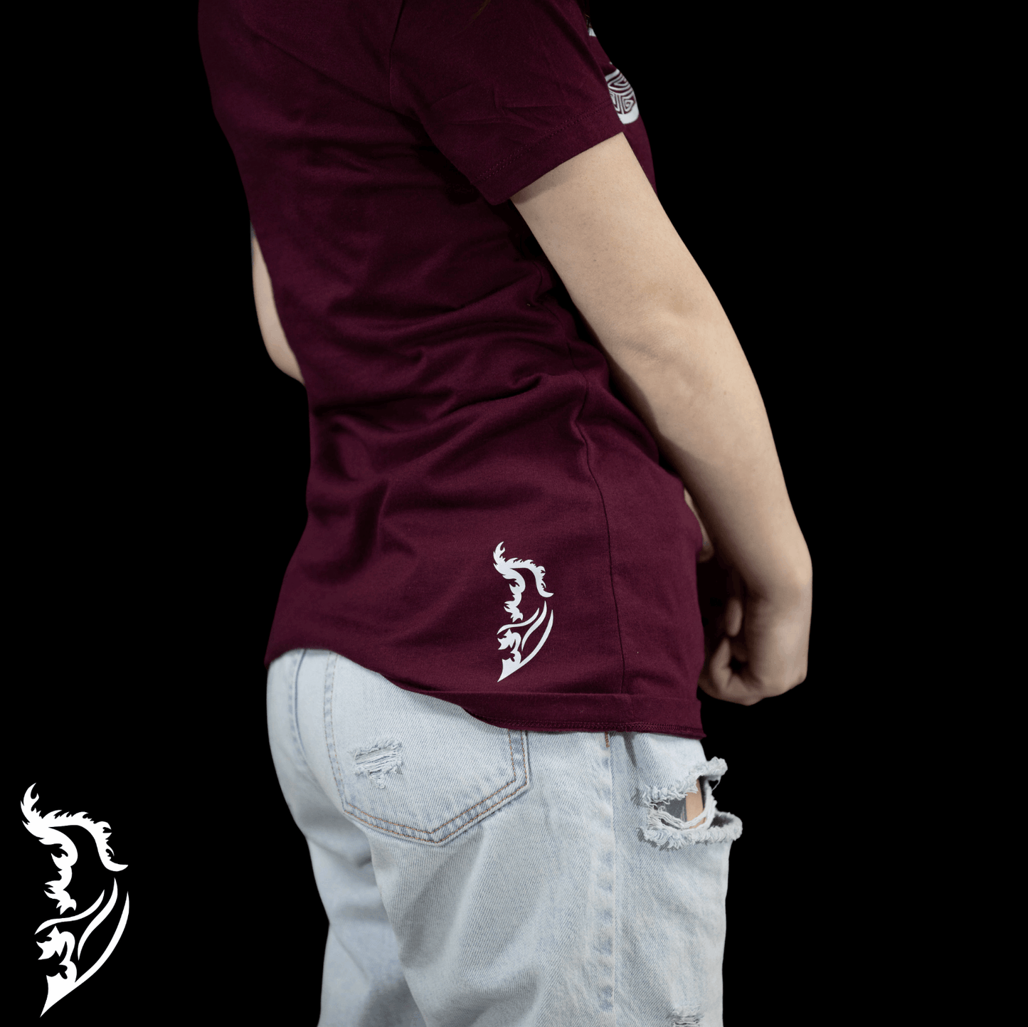 White Angel wing logo on right bottom side of shirt