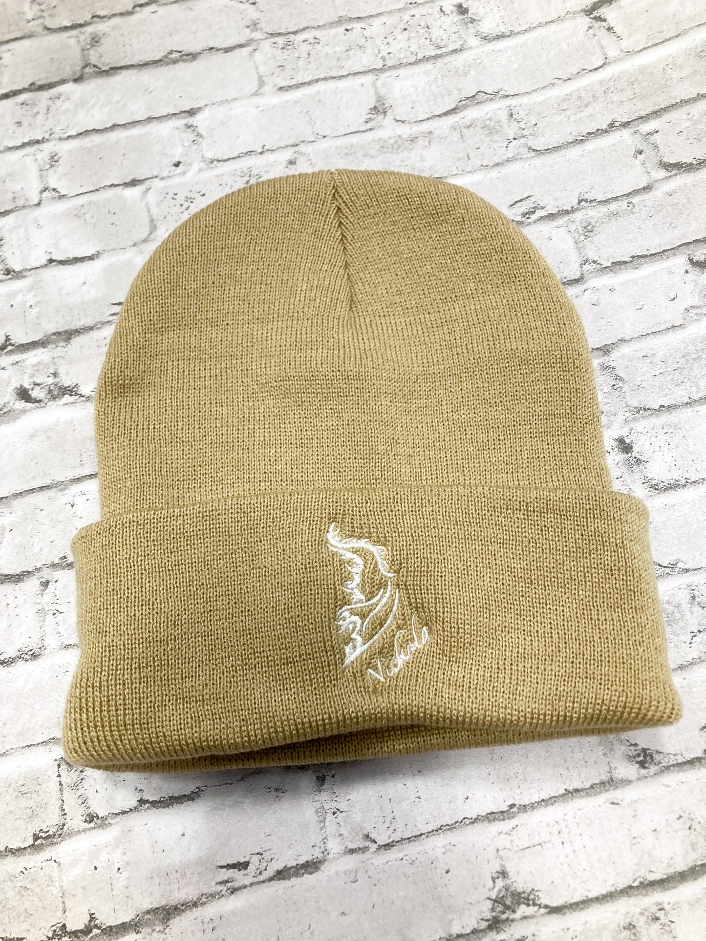 Product image of a streetwear beanie camel colored, made from soft knit fabric.