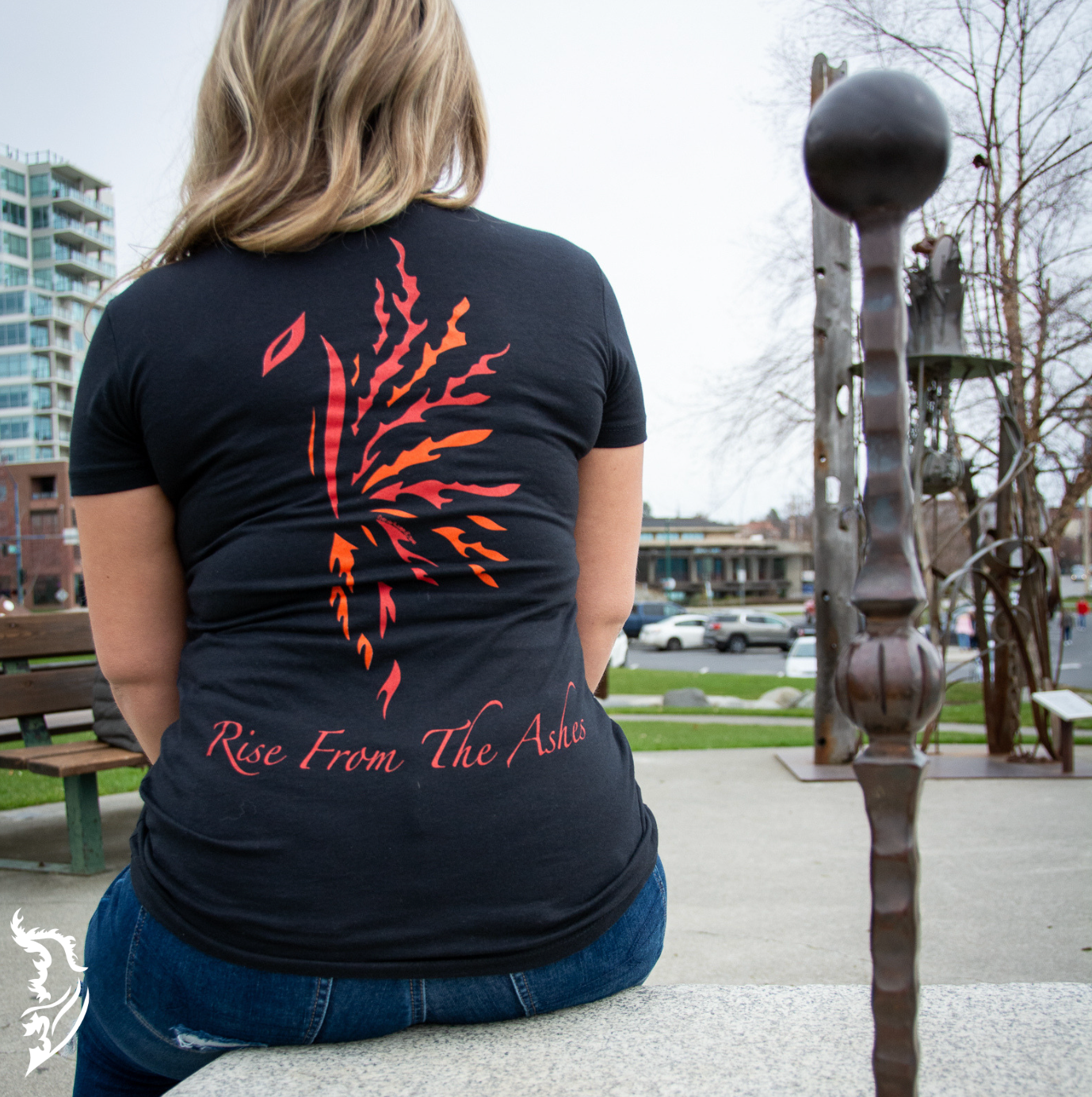 Hand-drawn Phoenix in Red, Orange and Yellow with Rise from the Ashes written below