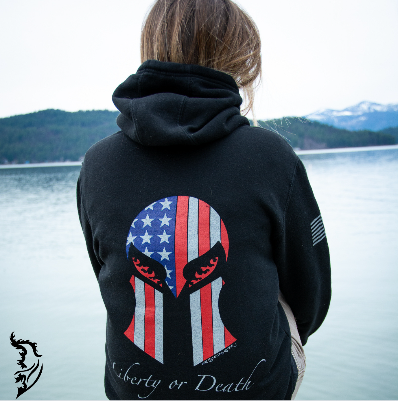 Powerful back print of a Spartan helmet with 'Liberty or Death' text, featuring the American flag design on a black hoodie.