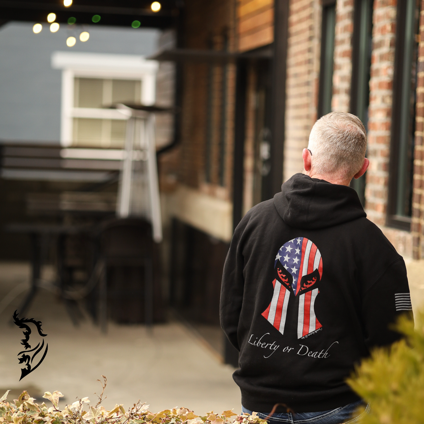 Back view of a black hoodie featuring a Spartan helmet masked by the American flag, with 'Liberty or Death' text in bold font.