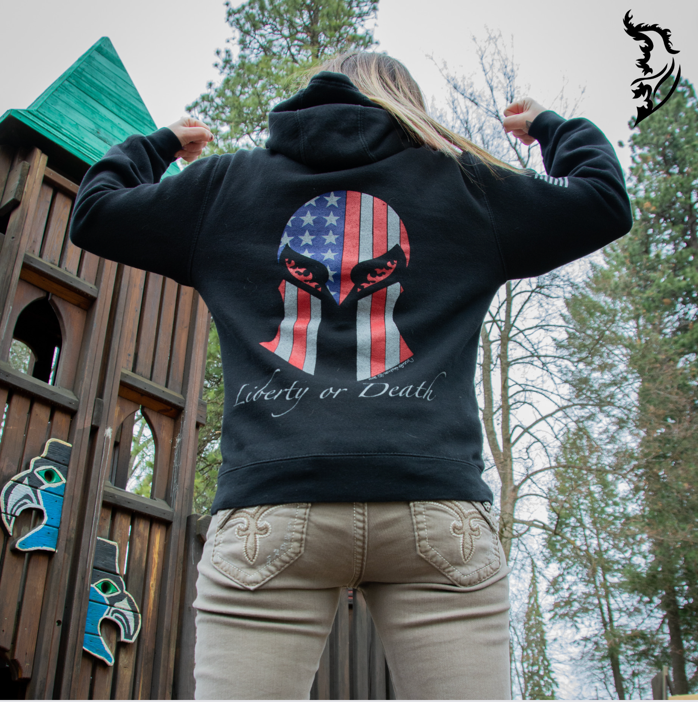 Detailed back design of a Spartan helmet masked by the American flag with 'Liberty or Death' text, symbolizing freedom and strength.