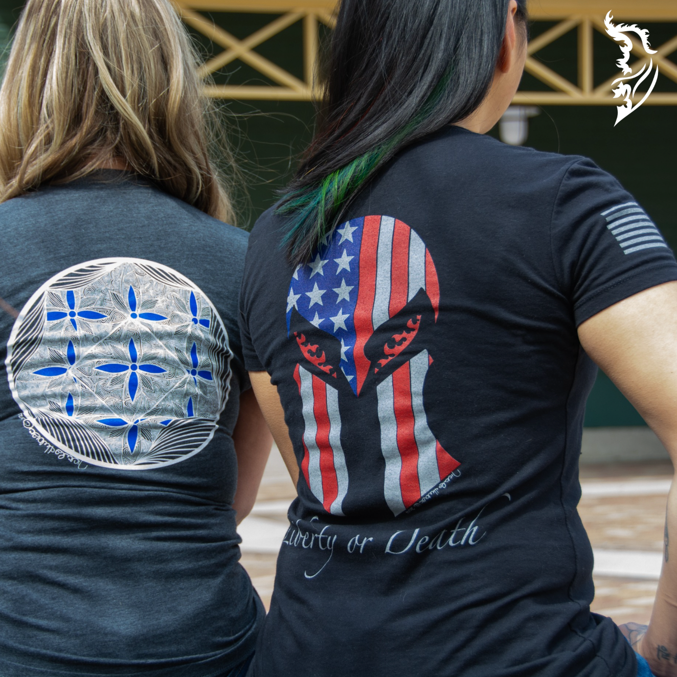 Black tee with a back design of a Spartan helmet and 'Liberty or Death' text, showcasing a powerful combination of patriotism and courage.