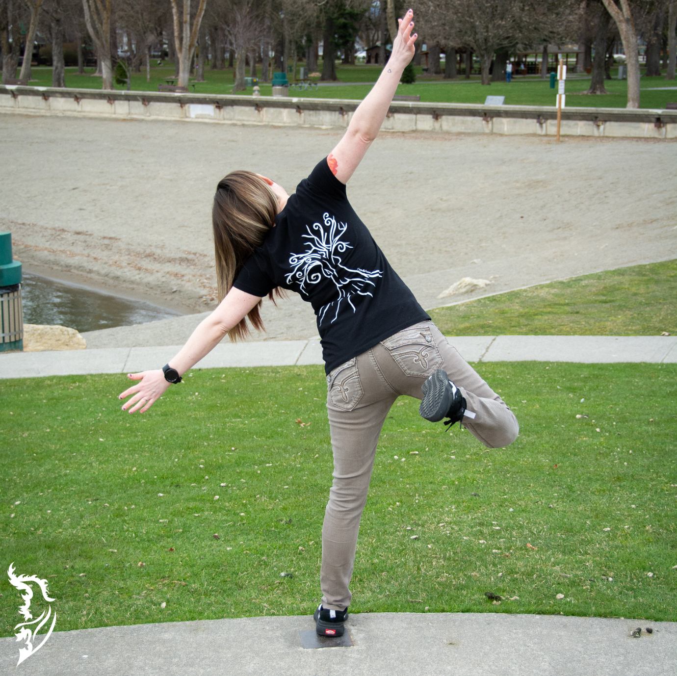 Black T-shirt featuring a hand-drawn line art design of a woman within a tree on the back center.
