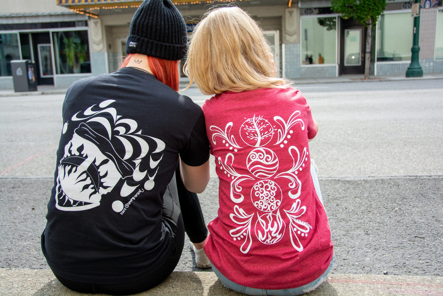 Hand-drawn Elements in white down back center of shirt