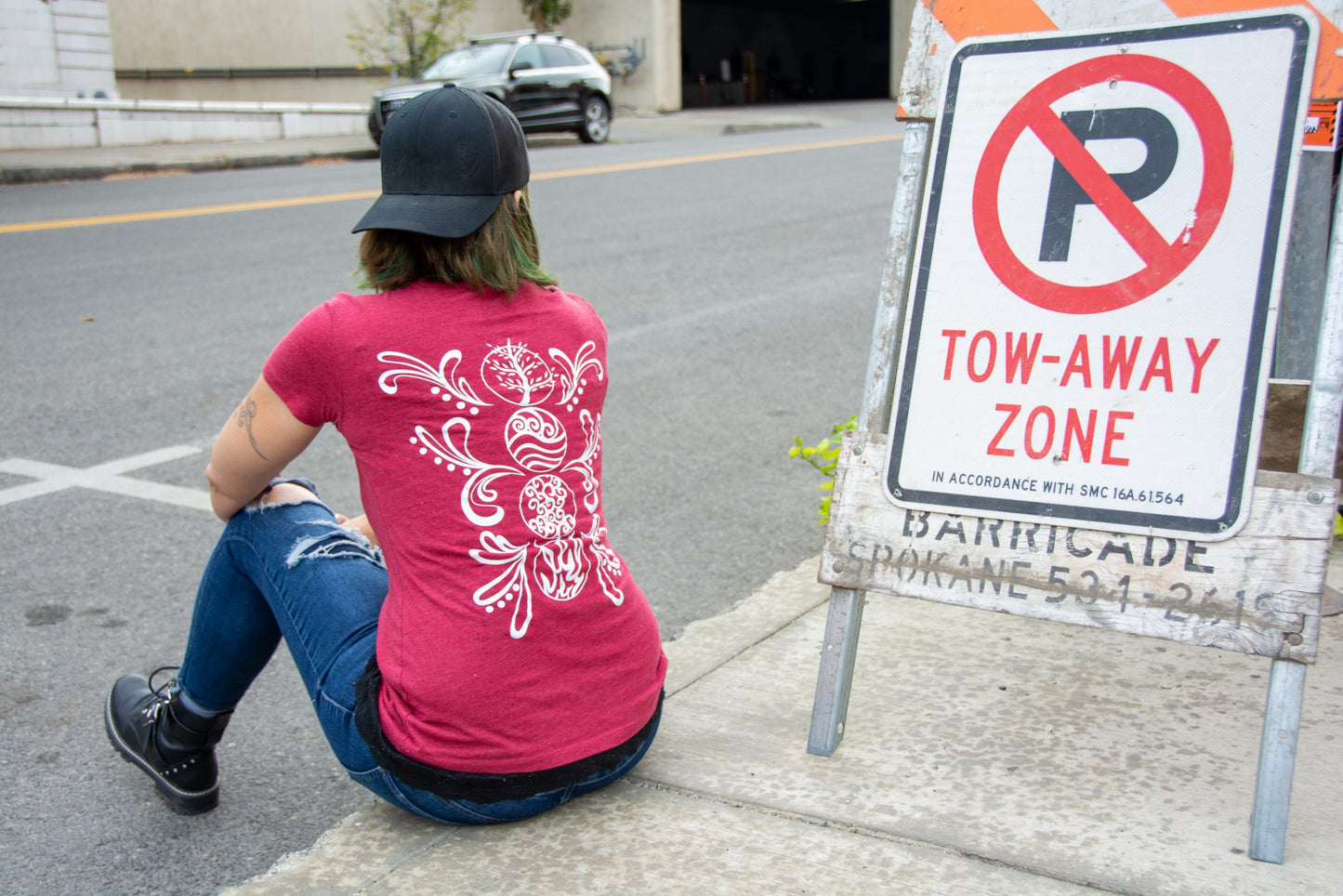 Hand-drawn Elements in white down back center of shirt