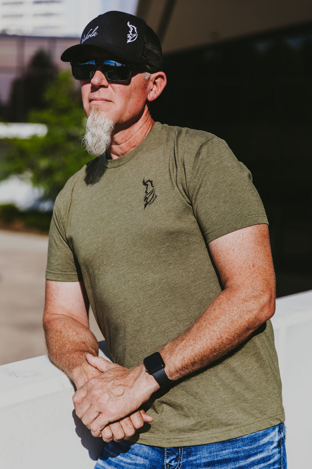 Black Angel Wing Logo on front left chest