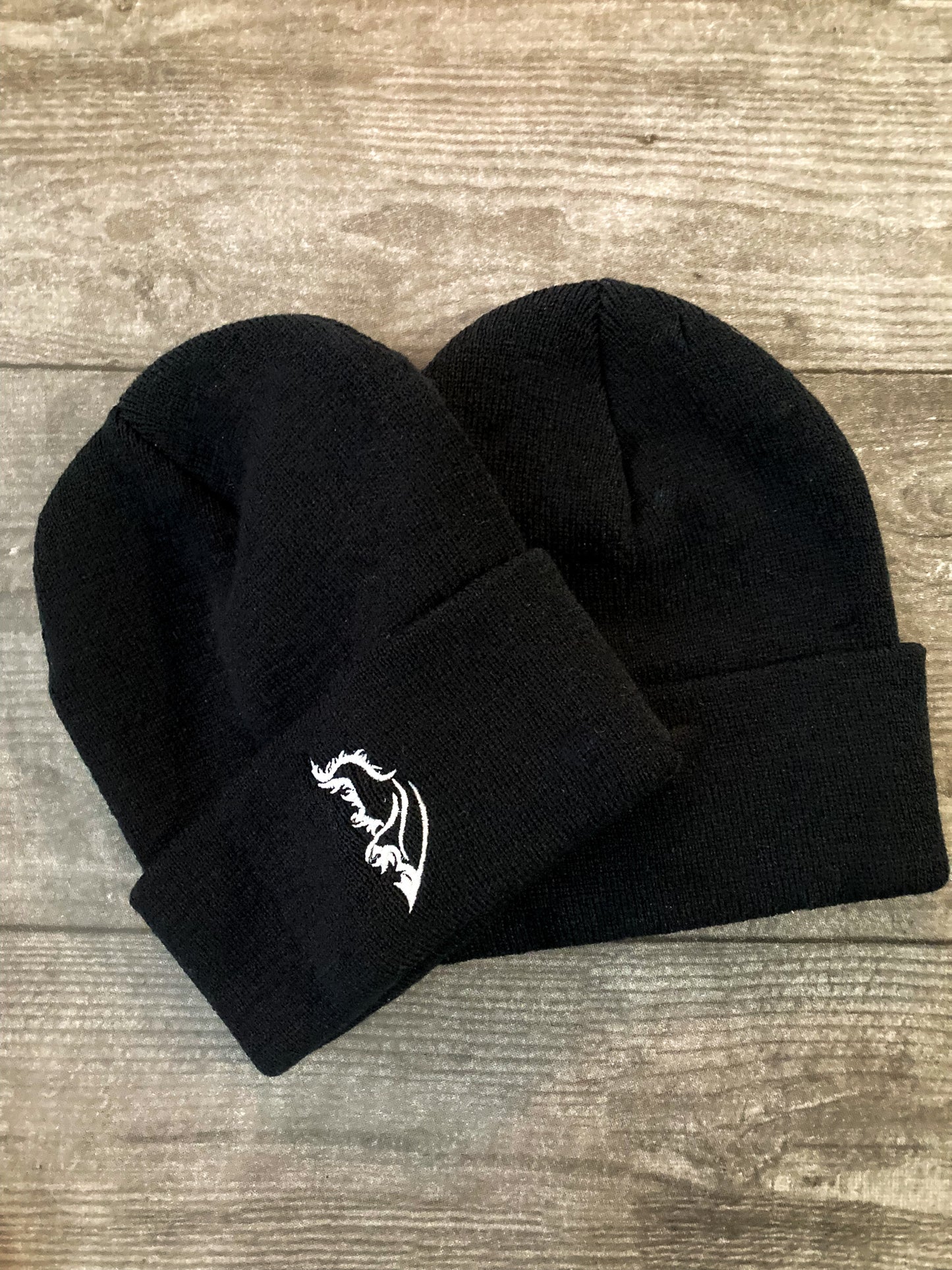 Product image of a streetwear beanie in classic black, made from soft knit fabric.