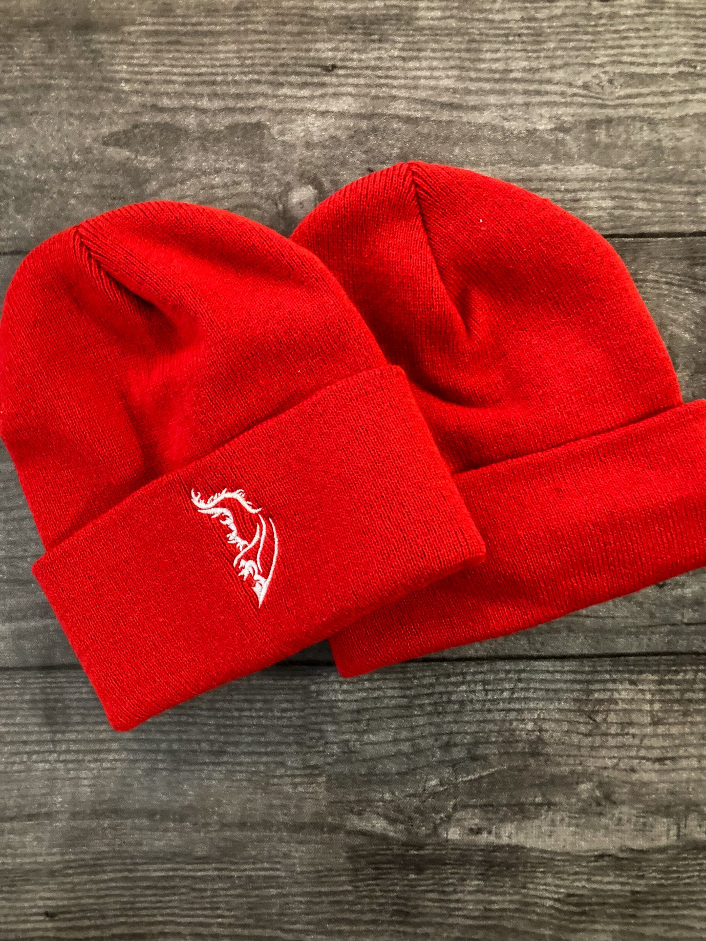 Front and back product image of a streetwear beanie in red, made from soft knit fabric.