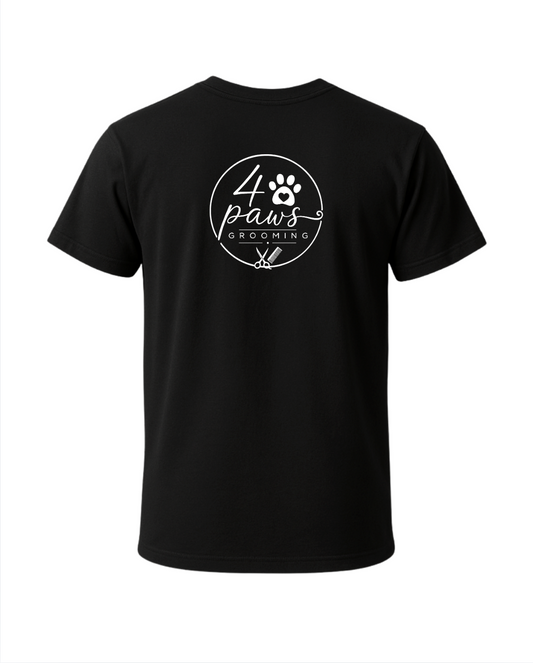 Back view of a black 4 Paws Grooming men’s T-shirt featuring a large white logo with a paw print, heart, grooming scissors, and comb.