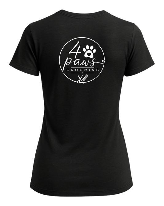 Back view of a black 4 Paws Grooming ladies’ T-shirt featuring a large white logo with a paw print, heart, grooming scissors, and comb.