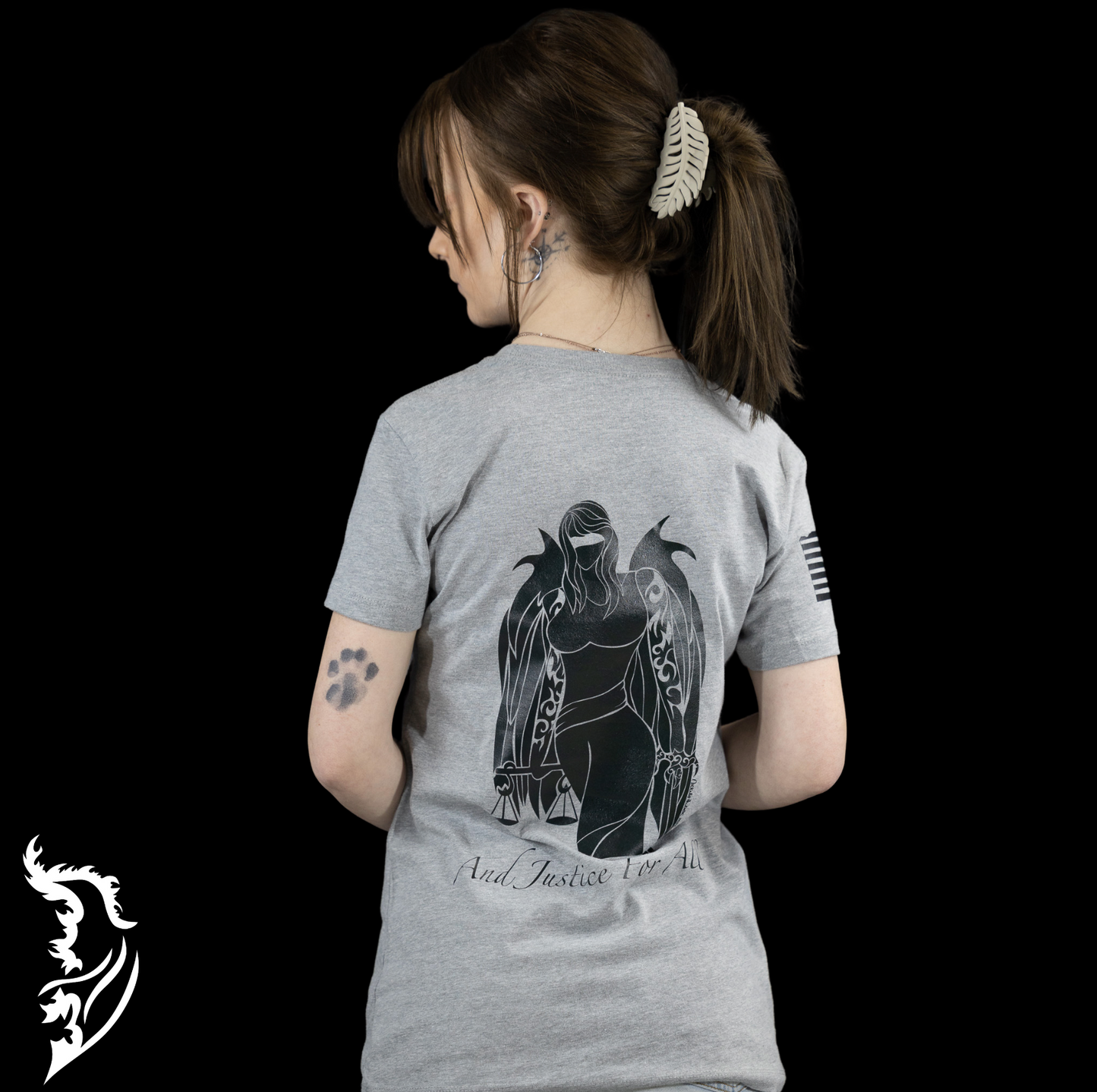 Angel of Justice Ladies T-Shirt featuring hand-drawn art depicting a striking angelic figure symbolizing fairness and equality, designed for personal expression and street style fashion. Unique wearable art piece blending artistic clothing with bold, trendy style.