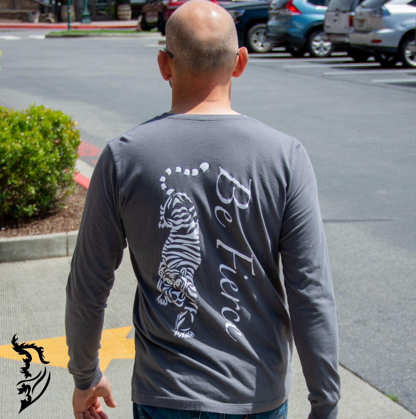 Step out in style with the Street Style by Nickola Be Fierce Tiger Long Sleeve. This classic shirt is a must have for your wardrobe, and will be a fierce competitor for your favorite shirt. The tiger symbolizes willpower, courage and personal strength, so face the day with a reminder of your inner power.