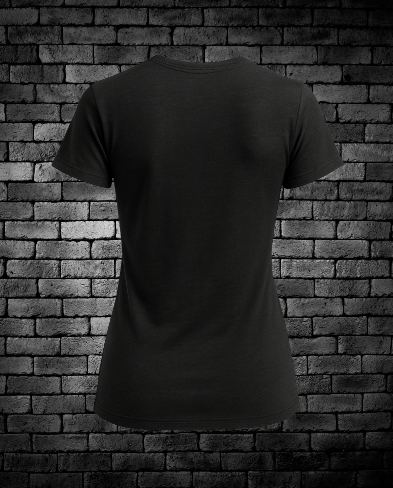 Black t-shirt against a brick wall