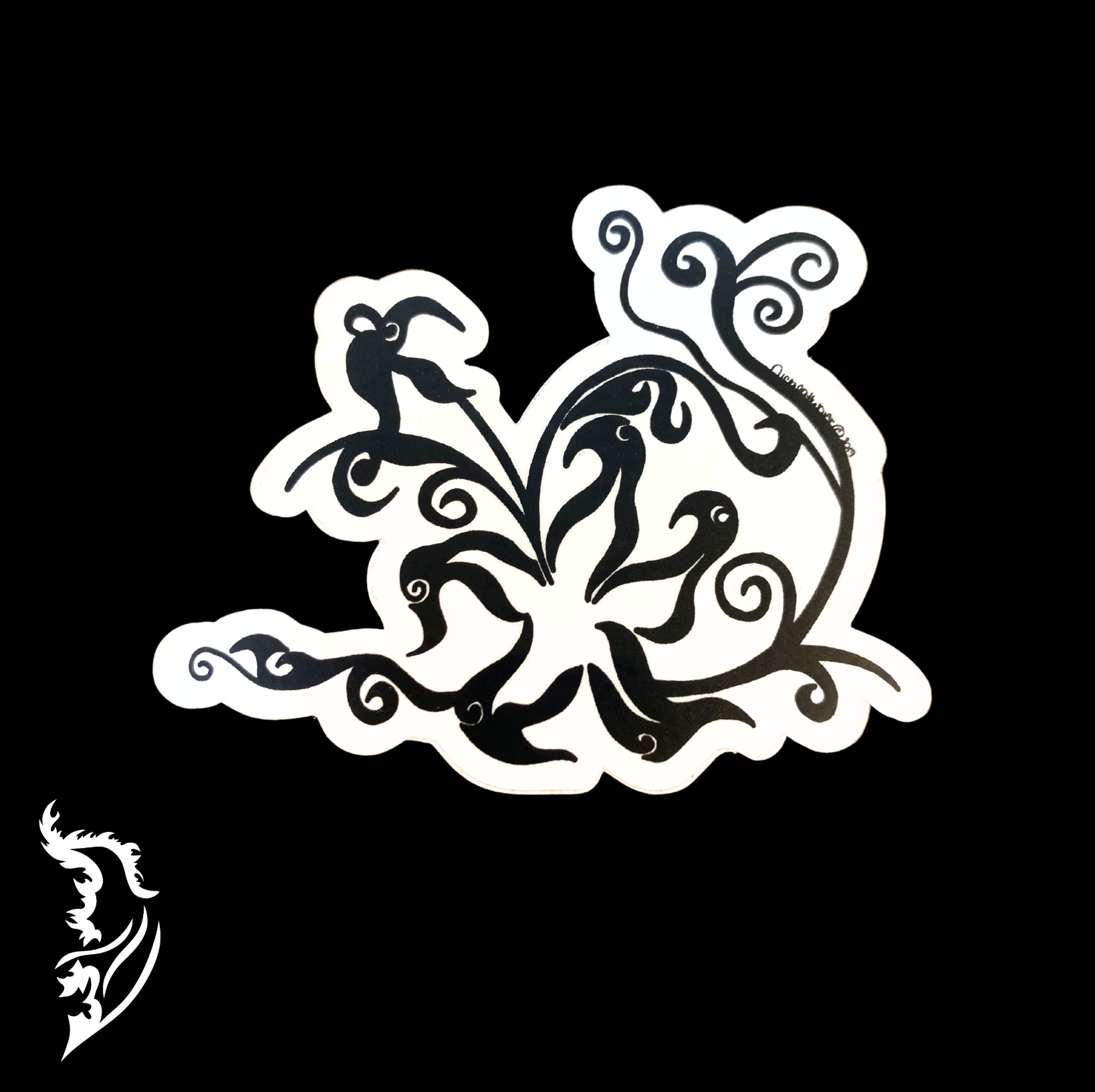 Black-and-white hand-drawn floral vinyl sticker with swirling, flowing petal design on a dark background.
