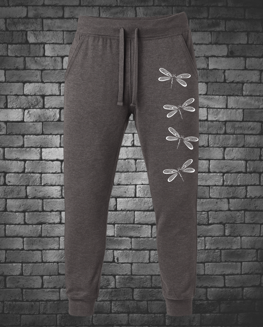 Four White Hand-drawn Dragonflies down front left leg