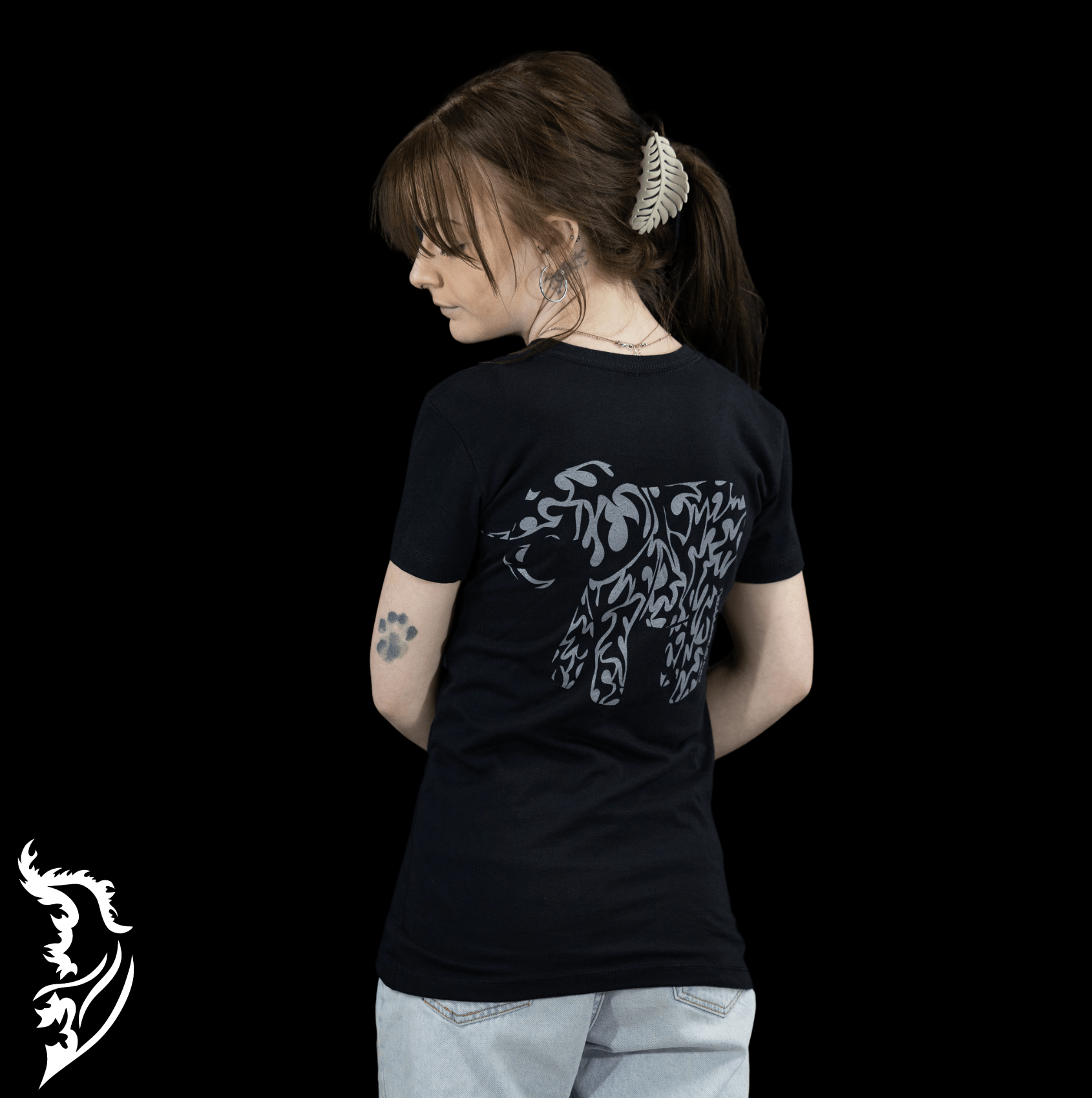 Hand-drawn Grey tribal styled elephant on back center of black t-shirt