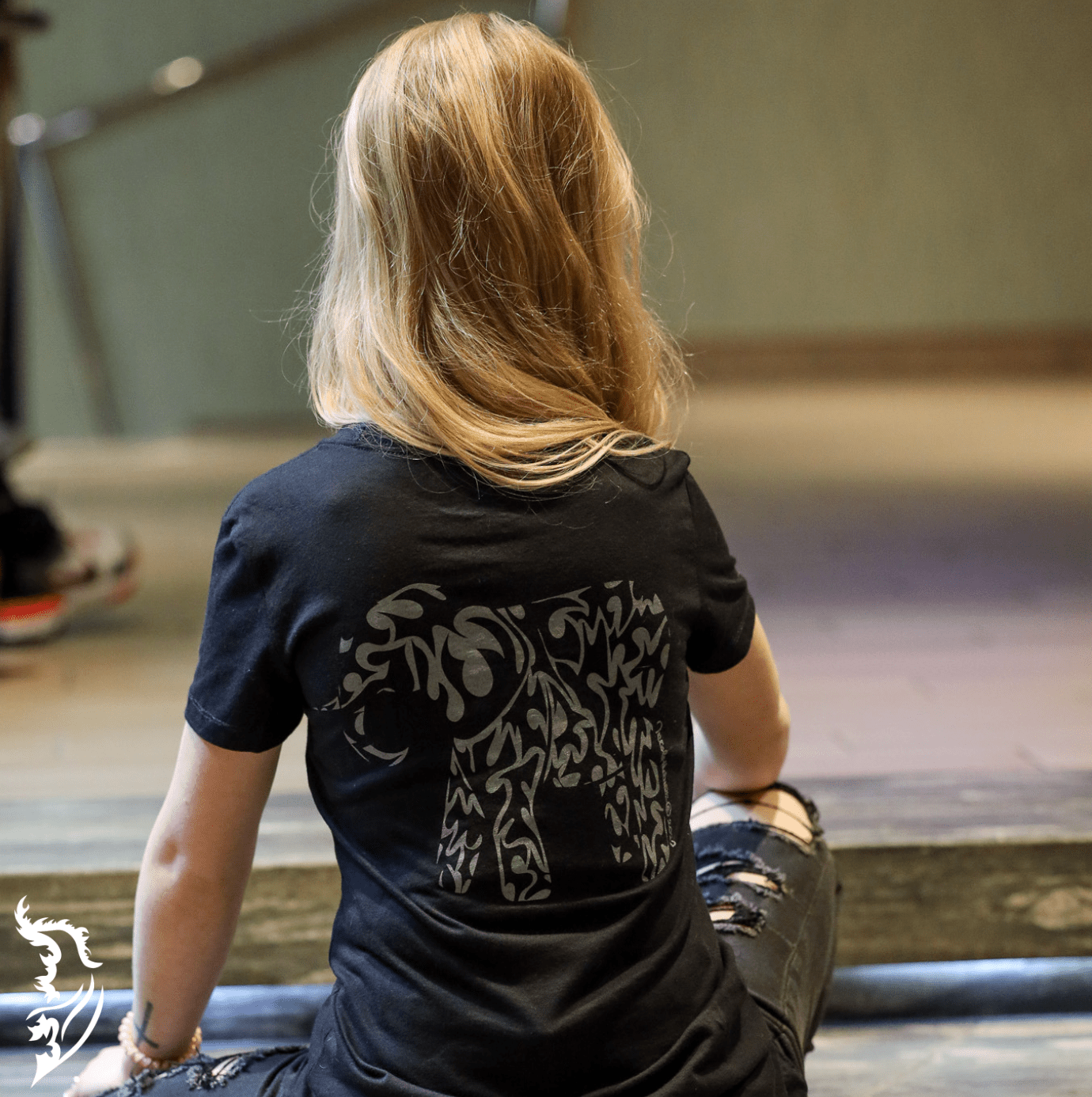 Hand-drawn Grey tribal styled elephant on back center of black t-shirt