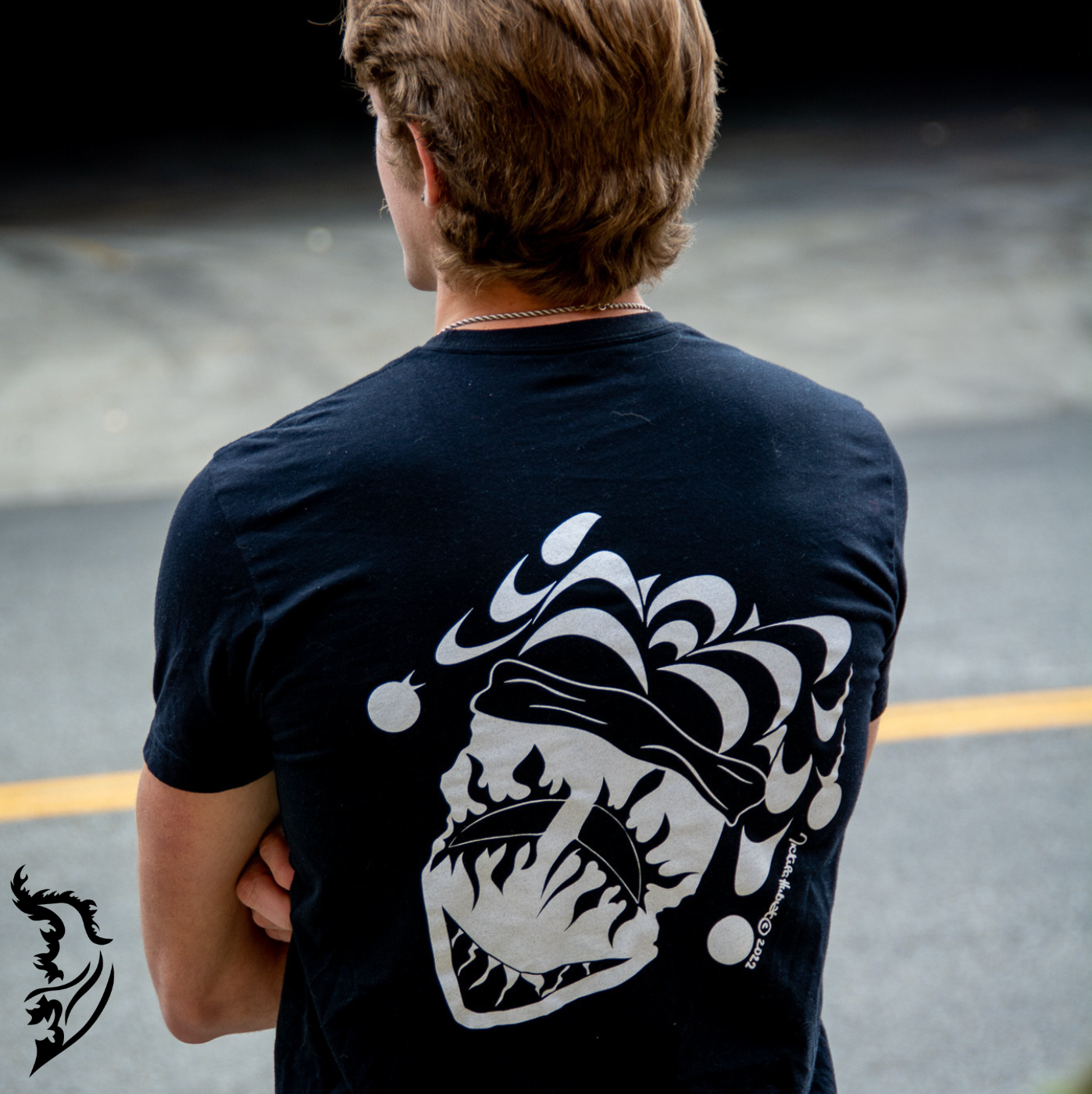 Male Model wearing Joker Tee standing on the side of the street