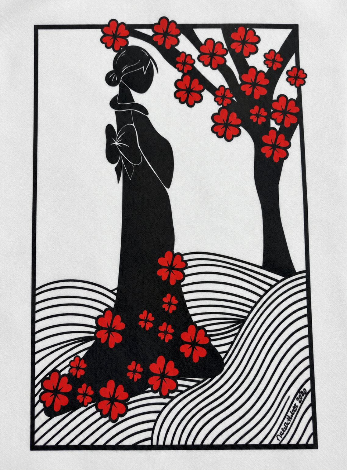 Close-up of the original hand-drawn Lady with Cherry Blossoms artwork printed in black and red on a white hoodie.