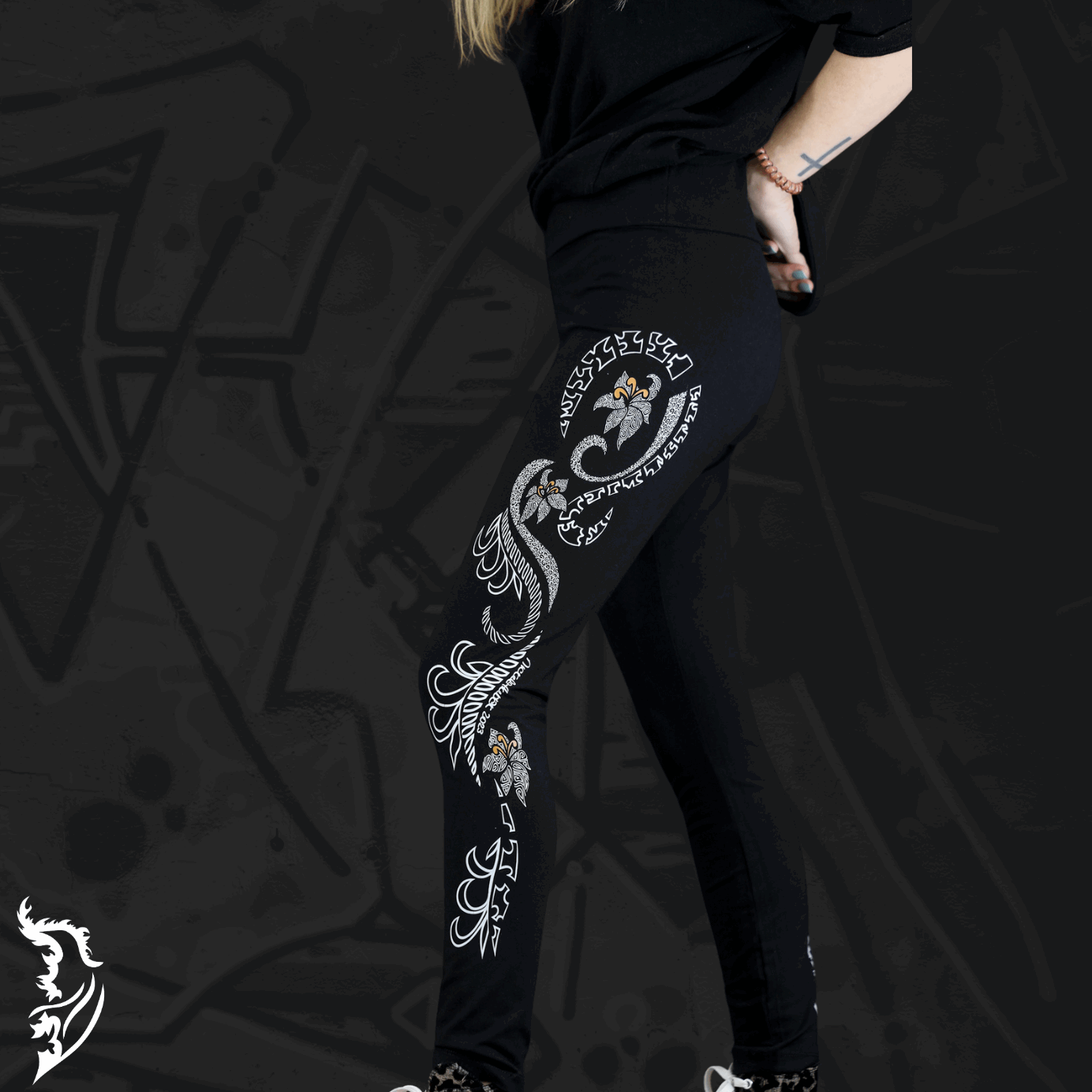 Model Wearing Lily Leggings showing Hand-drawn Lily design left side of leg