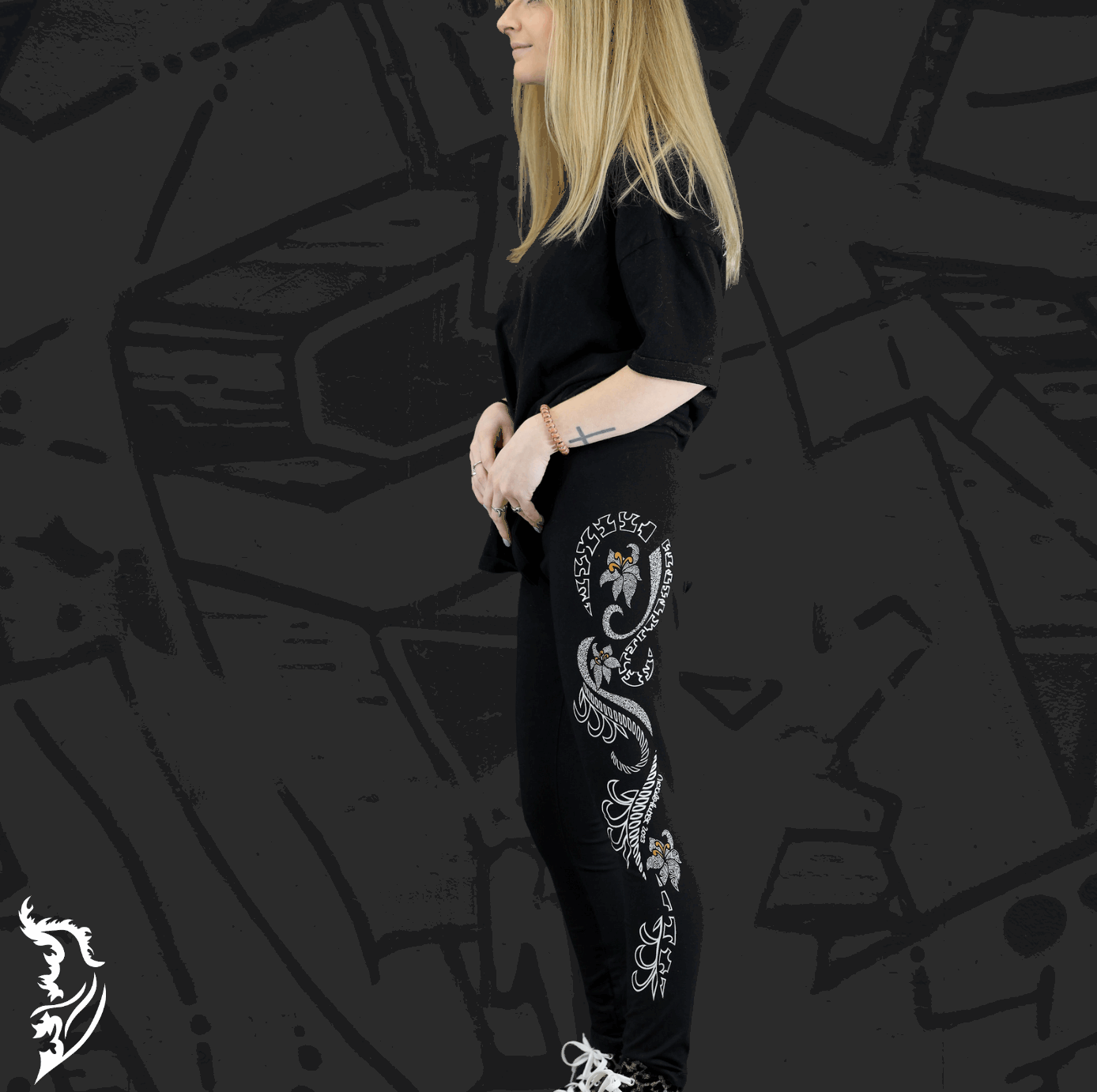 Model Wearing Lily Leggings showing Hand-drawn Lily design left side of leg
