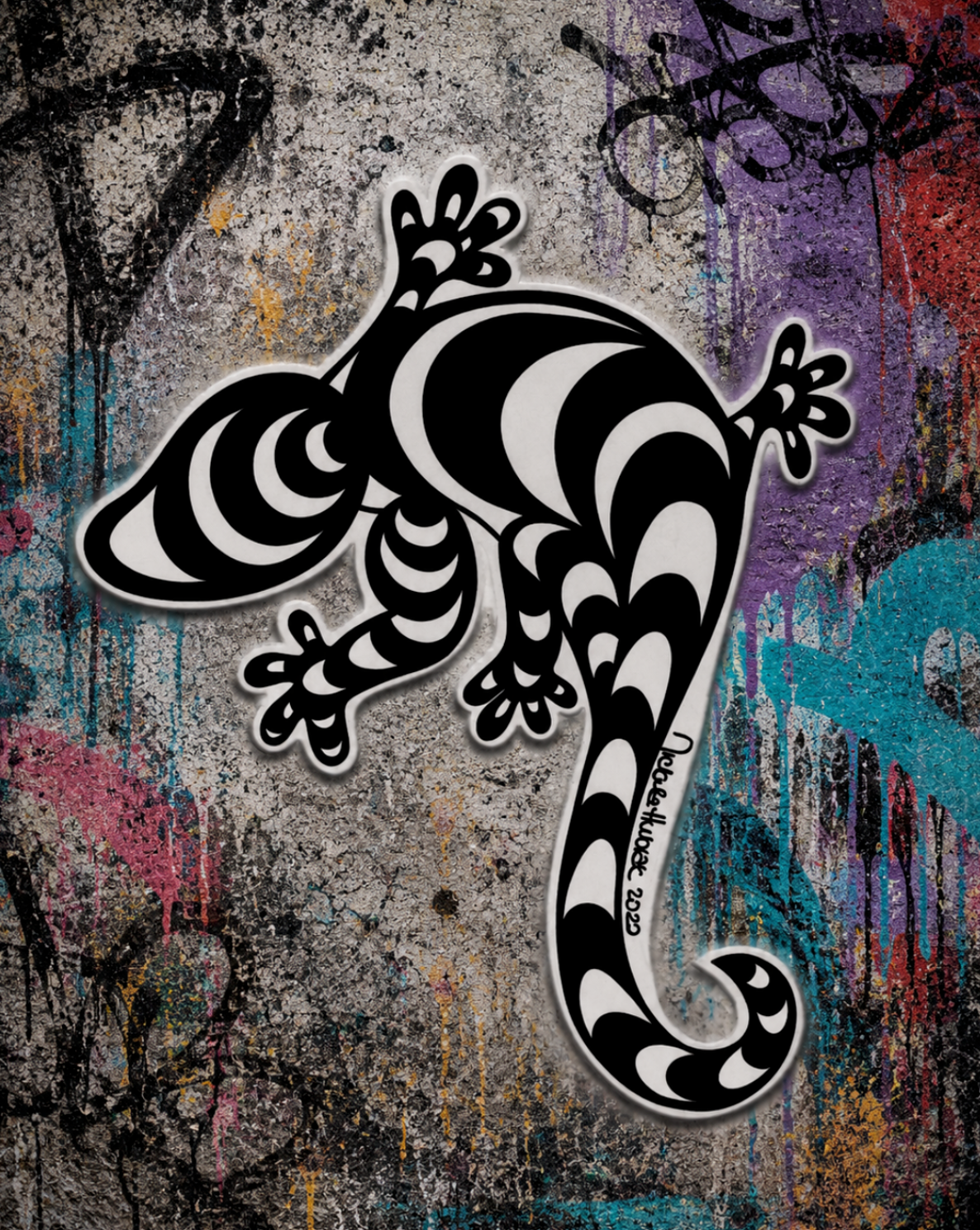 Black and white hand-drawn Lizard UV decal sticker displayed on a colorful Street Style by Nickola graffiti wall background featuring bold tribal-inspired patterns and an urban street-art aesthetic.