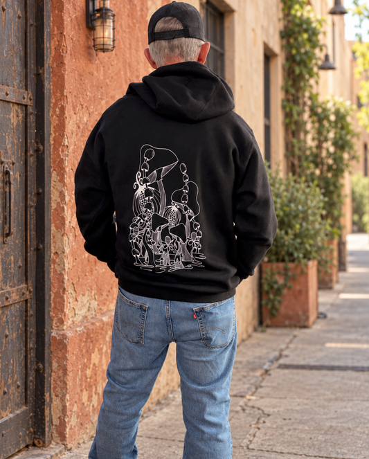 A 6'1", 190 lb model wearing an XL black Magic Mushroom hoodie, shown from behind. A large white hand-drawn illustration of mushrooms and small flowers covers the back.