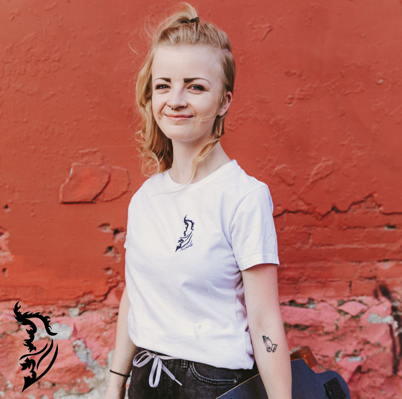 Model wearing Overwatch Tee Front View with Black Angel Wing Logo on front left chest of white tee