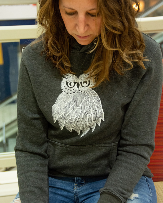 Female Model wearing Owl Hoodie with hand-drawn lined owl on front 