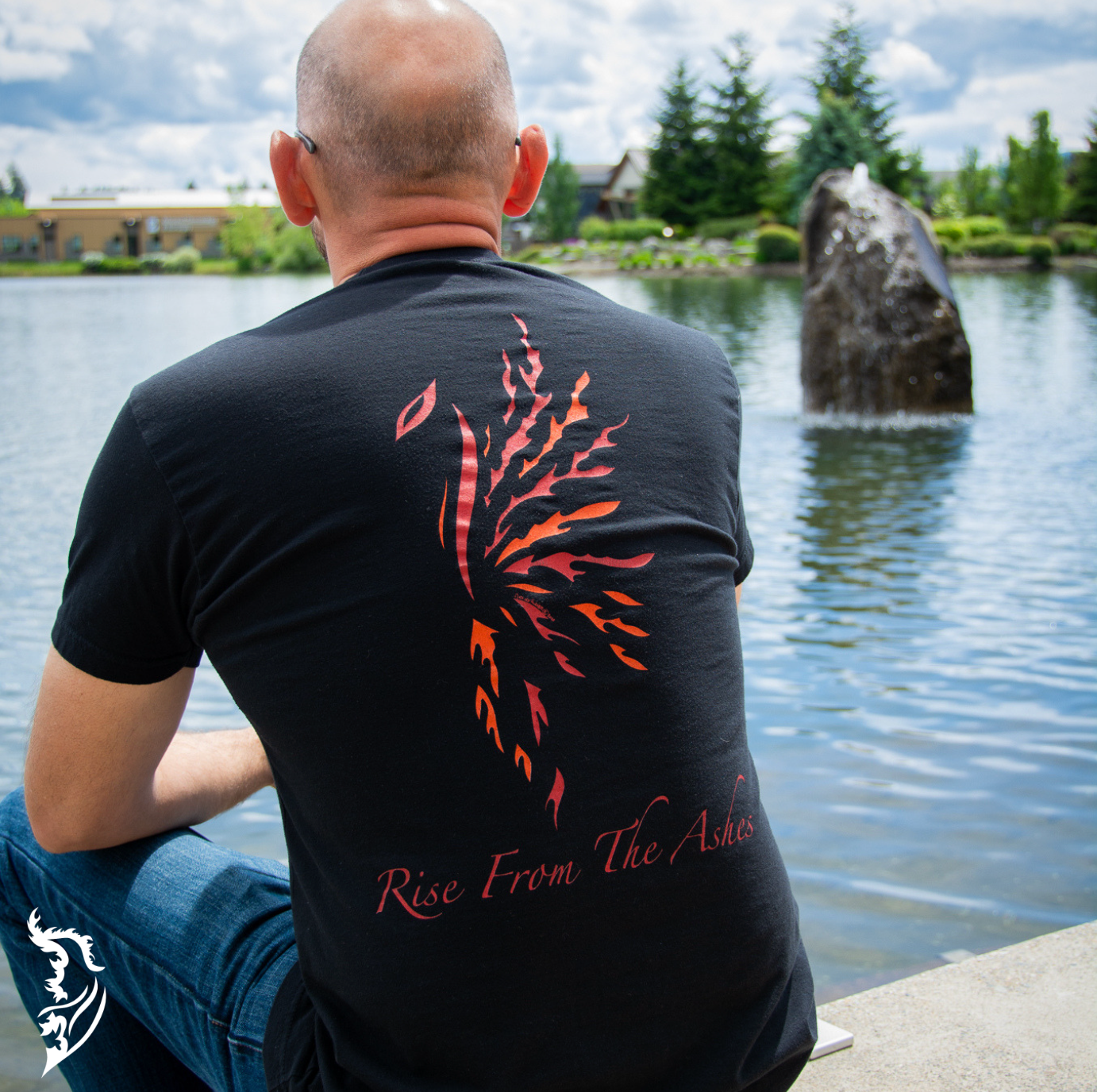 Hand-drawn Phoenix in Red, Orange and Yellow with Rise from the Ashes written below