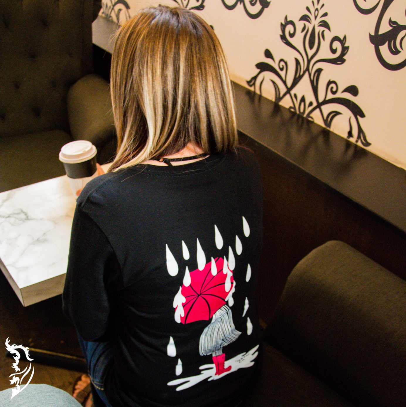 Hand-drawn Lady with Red Umbrella standing in puddle with rain drops surrounding her on black long sleeve t-shirt