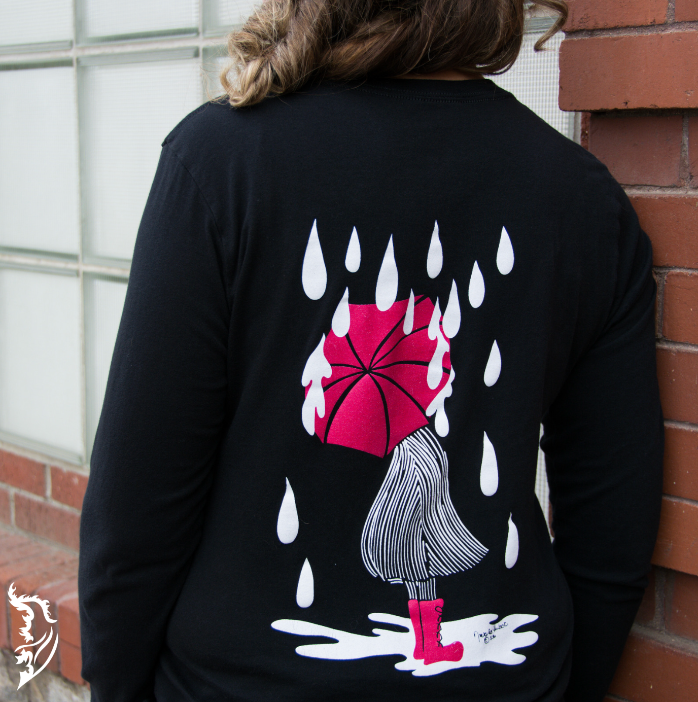 Hand-drawn Lady with Red Umbrella standing in puddle with rain drops surrounding her on black long sleeve t-shirt