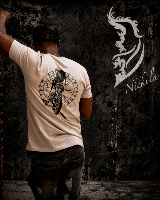 Man wearing Hand-drawn Shield Maiden Silk t-shirt by Street Style by Nickola leaning against a gritty urban wall with rune circle and raven artwork on the back, set against a dark industrial streetwear background.