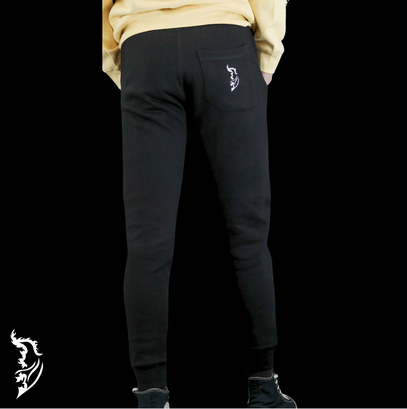 Model wearing ultra-soft fleece Skeleton Snowboarder joggers, featuring a bold hand-drawn design, styled for winter comfort and snowboarding lifestyle