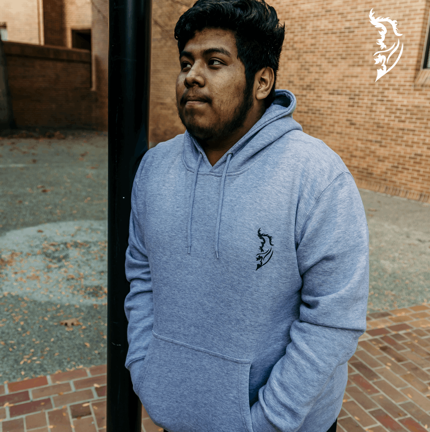 Black Angel Wing logo on front left chest of heather grey hoodie