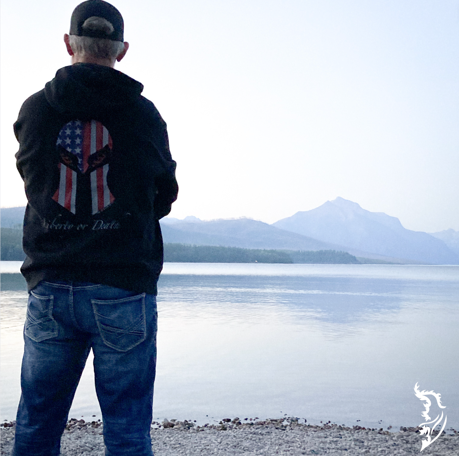 Hand-drawn Spartan helmet design on the back of a black hoodie, with the American flag pattern and 'Liberty or Death' lettering.