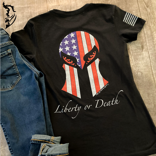Back view of a ladies tee featuring a Spartan helmet masked by the American flag and 'Liberty or Death' text for a bold, patriotic statement.