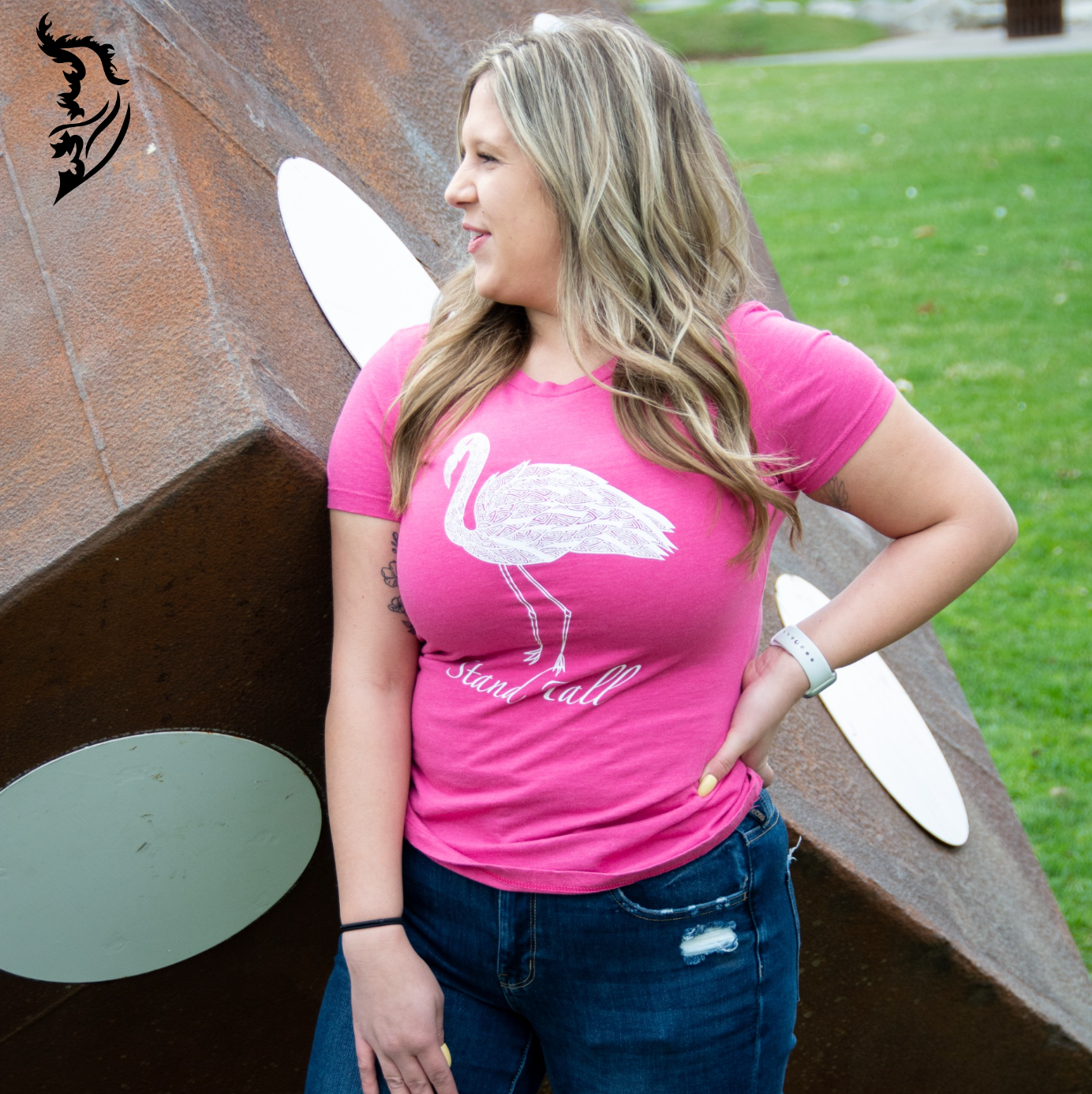 Hand-drawn Lined Flamingo with Stand Tall written below in white on raspberry tee