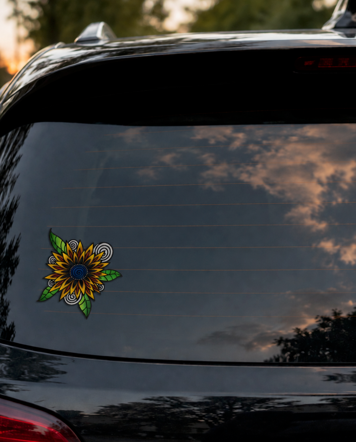 Hand-drawn sunflower car window decal applied to the rear windshield of a black SUV, photographed at sunset with reflective glass and a clean borderless sticker finish.