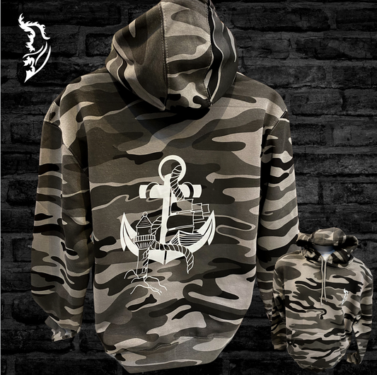 A hand-drawn design on a hoodie featuring an anchor, lighthouse, and ship.  “Not all storms come to disrupt your life, some come to clear your path” by Paulo Coelho.