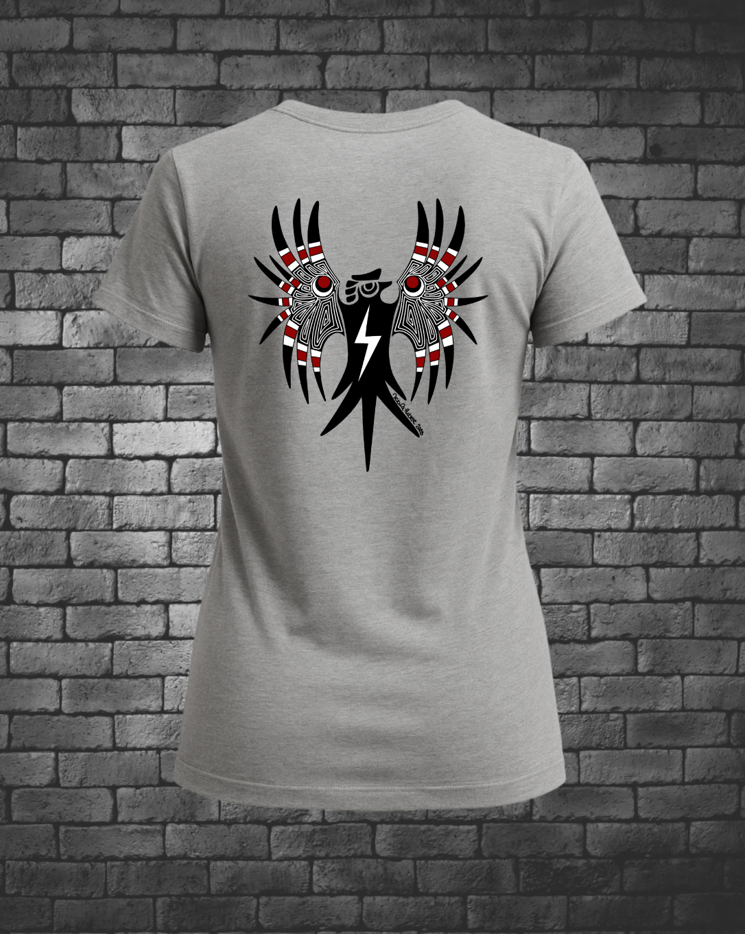 Hand-drawn Thunderbird in black, white and red on back of heather grey ladies T-shirt