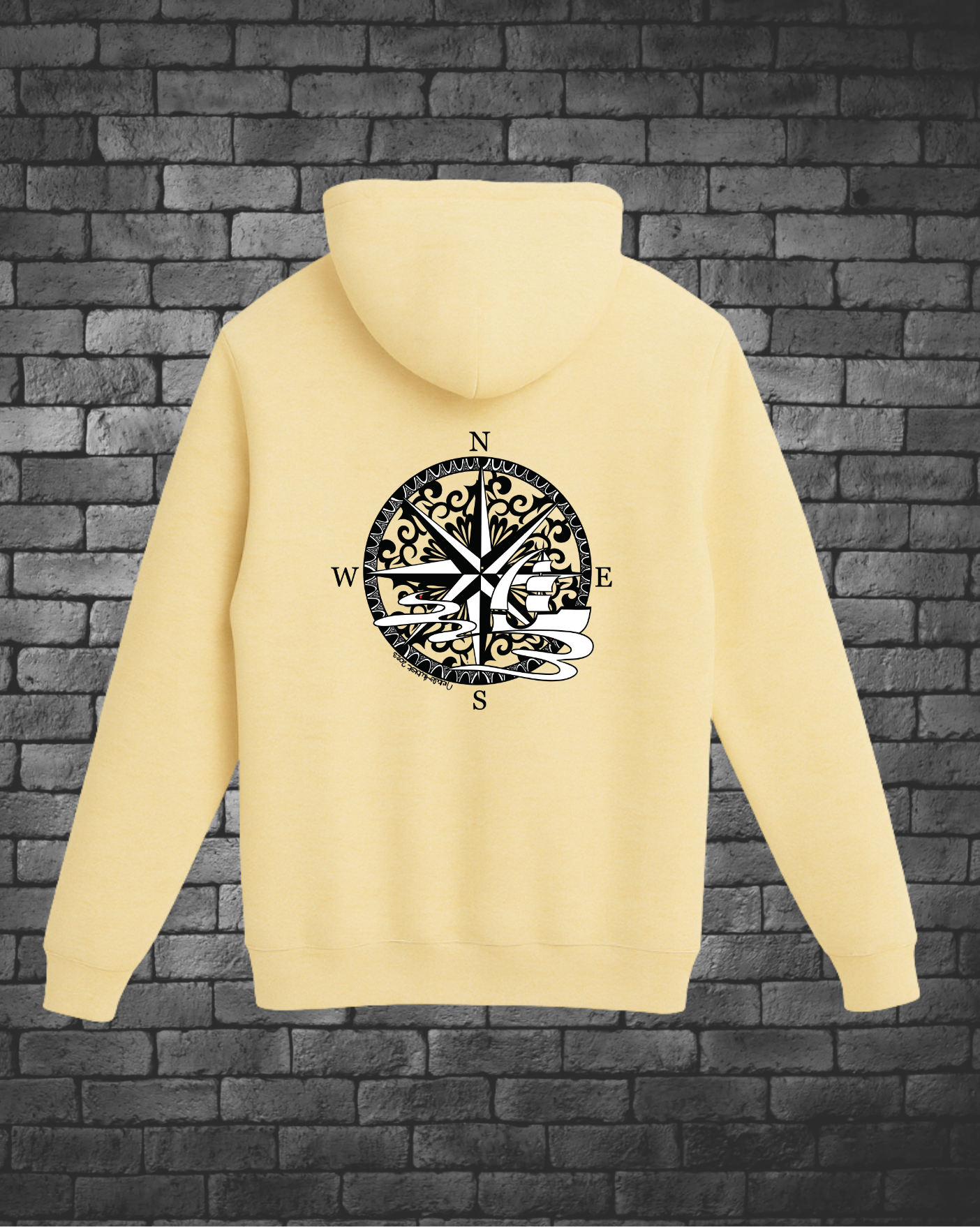 Hand-drawn Compass with Ship in black and white on back of yellow hoodie