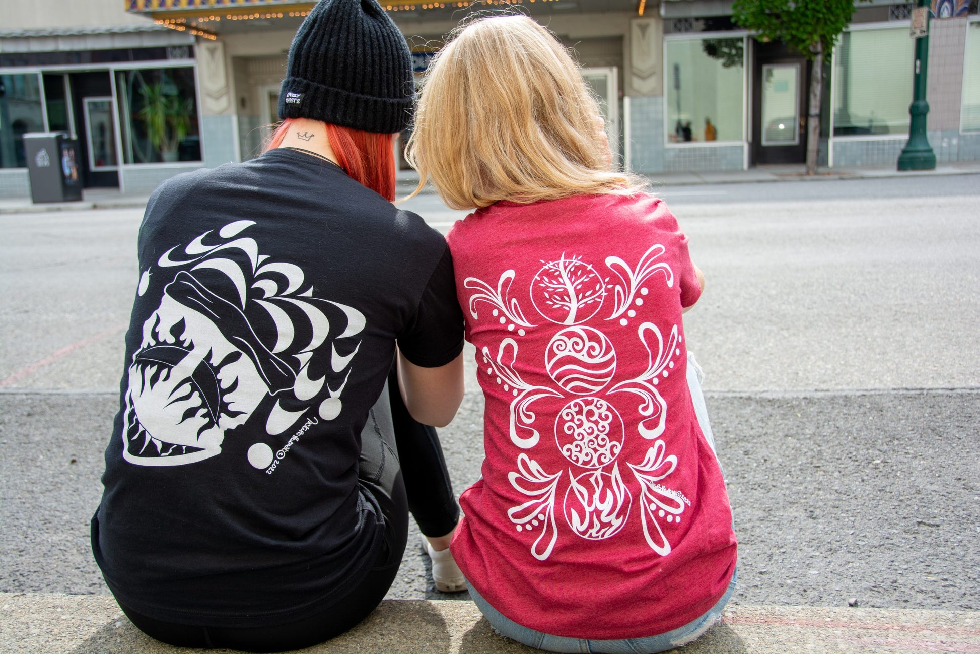 Hand-drawn Elements in white down back center of shirt