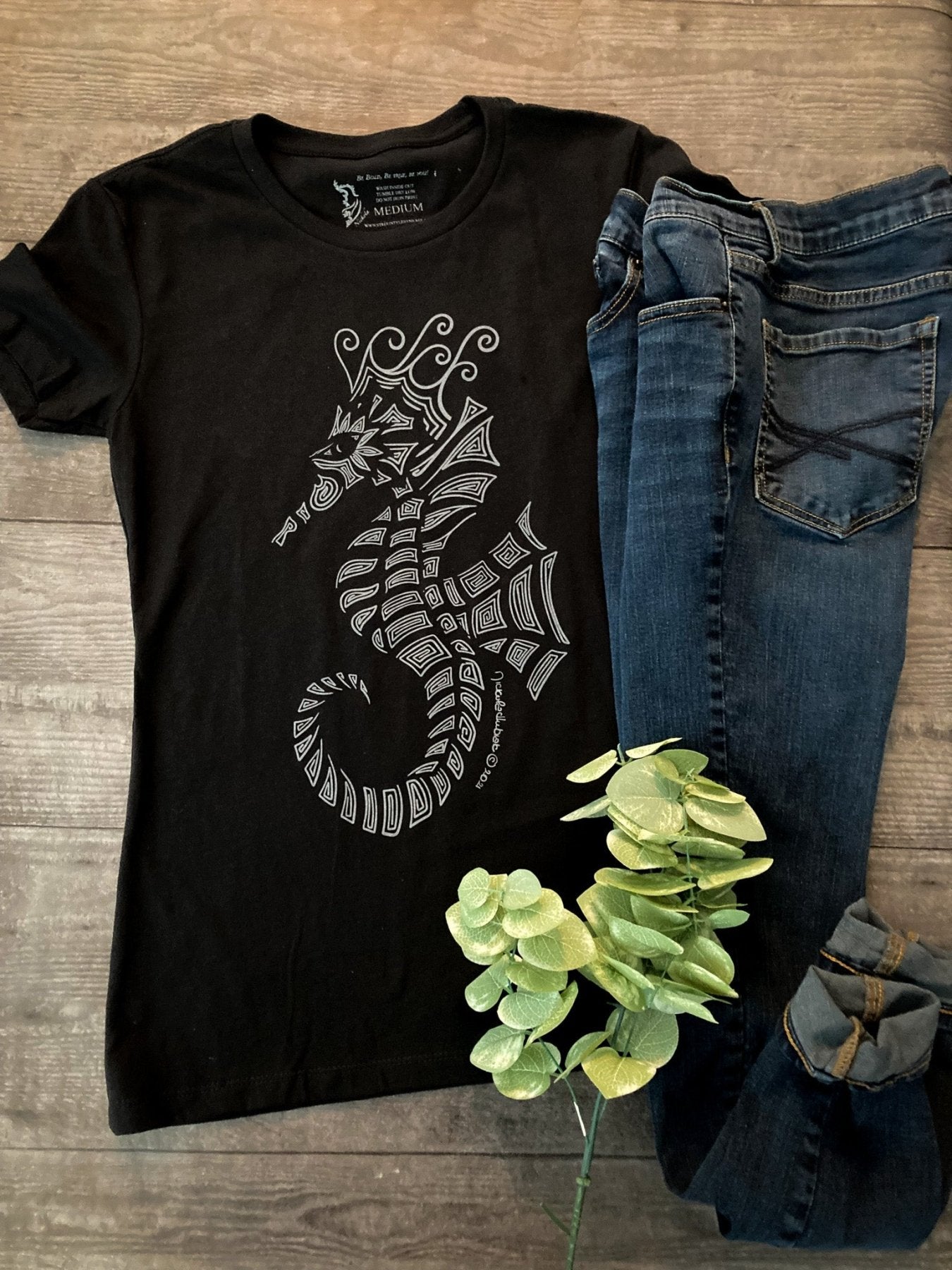 Hand-drawn lined Seahorse in grey on the front